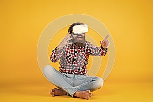 New reality is here. happy future. man wear wireless VR glasses. guy in VR headset. bearded hipster use modern