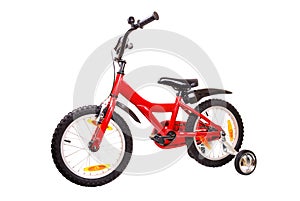 New red children's bicycle on white