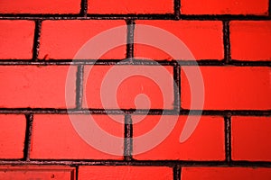 New red colour wall of bricks and cement of home. good background texture