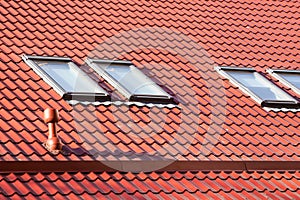 New red metal roof with skylights and Ventilation pipe for heat control. photo