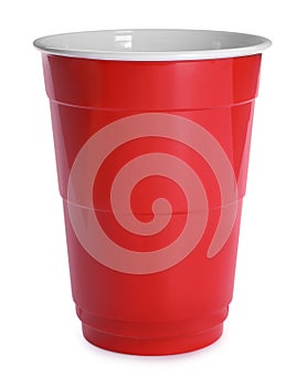 New red plastic cup on white background photo