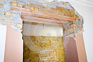 New reinforced brick lintel useful for creating a new door, or a new window, in an old stone and brick wall