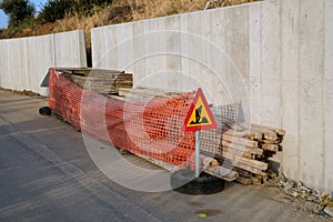 New Reinforced Concrete Wall, With Road Warning Sign