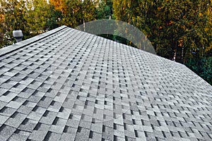 New renovated roof with shingles flat polymeric roof-tiles