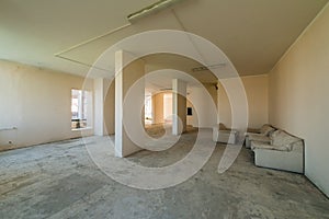 New residential apartment without finishing in modern home. Concrete walls and Communications