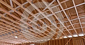 In a new residential building, wood rafters and joists are used to support roof.