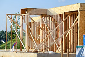 new residential construction home framing against a blue sky