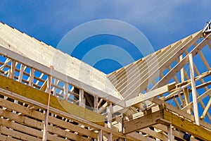 New residential construction home framing with a roof view