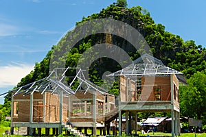 New residential construction house framing against a blue sky an