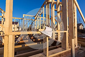 New residential construction of wooden frame house. Roofing construction. Wooden construction. Construction site.