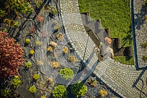 New Residential Garden Developing by Caucasian Landscaping Worker