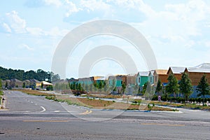 New residential neighborhood under construction with half built homes and newly planted trees in South Florida to address a