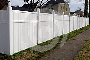 New resin fence in residential neighborhood.