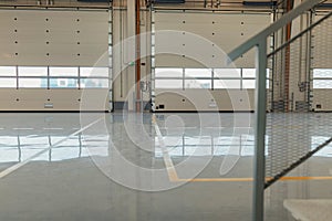 New resin floor coating and marking signs in a car workshop photo