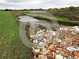 New road built in a field filled with rumble and debris