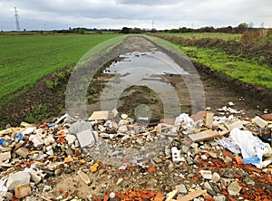 New road built in a field filled with rumble and debris