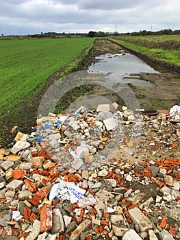 New road built in a field filled with rumble and debris