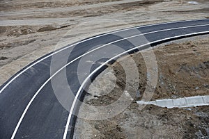 New road in construction and repair in a cloudy day.