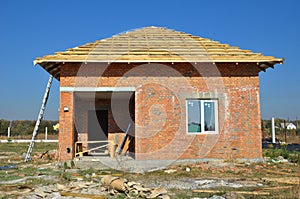 New Roof Membrane Coverings with Wooden Construction Home Framing with Roof Rafters Outdoor photo