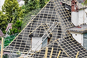 New roof under construction workers on roof