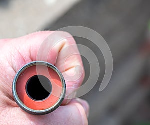 New rubber gasket being replaced in a garden hose female connection to have a water tight coupling. photo