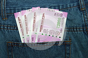 New 2000 rupee notes in an Indian mans jean back pocket.
