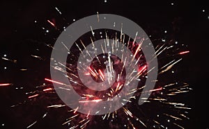 New\'s Year flashes of colorful fireworks against the sky.