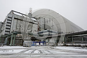 New Safe Confinement above remains of reactor 4 and old sarcophagus at Chernobyl nuclear power plant. Ukraine