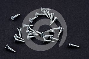 New screws on a black background