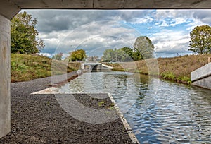 New section of the Stroudwater Navigation at Whitminster passing under the A38 road, Stroud England