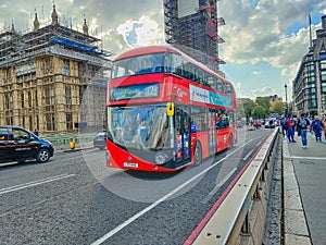 New shape Red London Routemaster bus on Westminster bridge