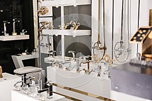 New shiny faucets in bathroom fixtures store