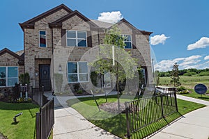 New single-family house with nice trim front yard near Dallas, Texas