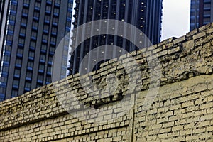 skyscrappers behind the wall photo