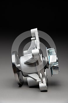 New spare part on a gradient gray background7 Internal combustion engine cooling system pump
