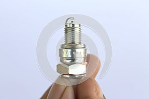 New spark plug in hand before use