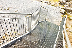 New staircase built with galvanized metal steps with improved ad