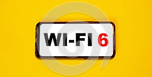 New standard WI-FI 6 - on a white background of a smartphone with an orange background