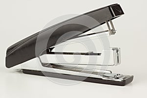 Stapler for stapling papers on a table