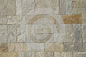 New stone wall closeup in sun