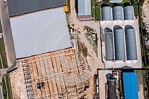 New storehouse building of logistic center under construction. aerial top view