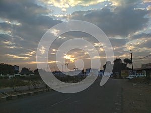 A new sunrise creating a pleasent view at an indian road sky looking like  an island of ice. photo