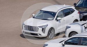 New SUVs in the parking lot of the dealership. Sale of new cars in a car dealership. copy space