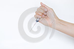 New syringe in girl hand on white background, medical and health care concept