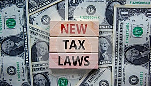 New tax laws symbol. Concept words \'New tax laws\' on wooden blocks