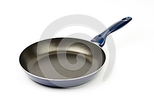 New teflon frying pan over white background