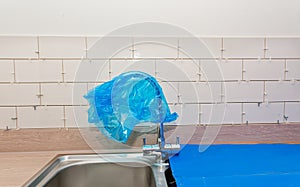 New tile installation in kitchen with electrical sockets removed