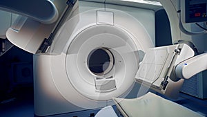 A new tomograph with monitor. Wide angle of a medical machine with one monitor.