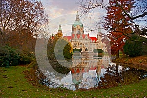 The New Town Hall and its reflection on surface of Maschteich Lake, Hanover, Germany