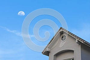New traditional gable roof house under moon sky